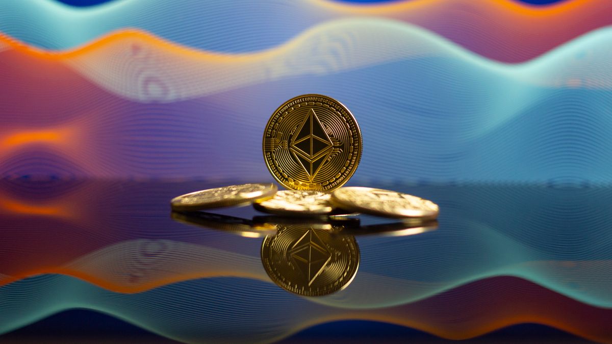 Golden cryptocurrency coins representing Tether and other digital currencies on a reflective surface