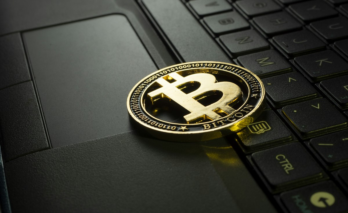 Close-up of a cryptocurrency coin on a dark background